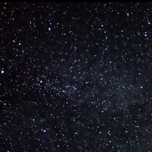 Time lapse video of the Milky Way gacefully turning around with shooting star like planes.